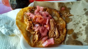 A salbute con cochinita y pickled cebolla from El Padrino in the central market in Merida.
